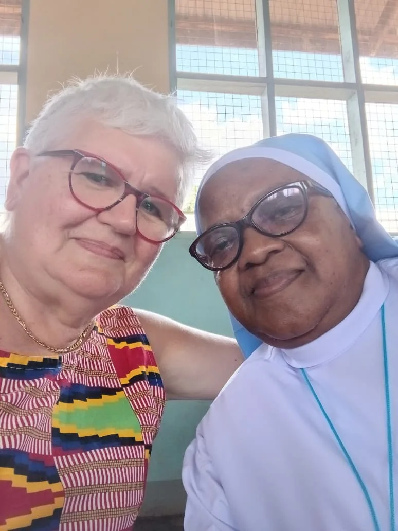A donor visiting with a member of the health centre team